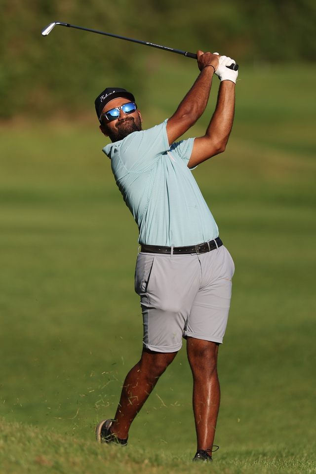 Yadhu Urs finishing a swing in late light